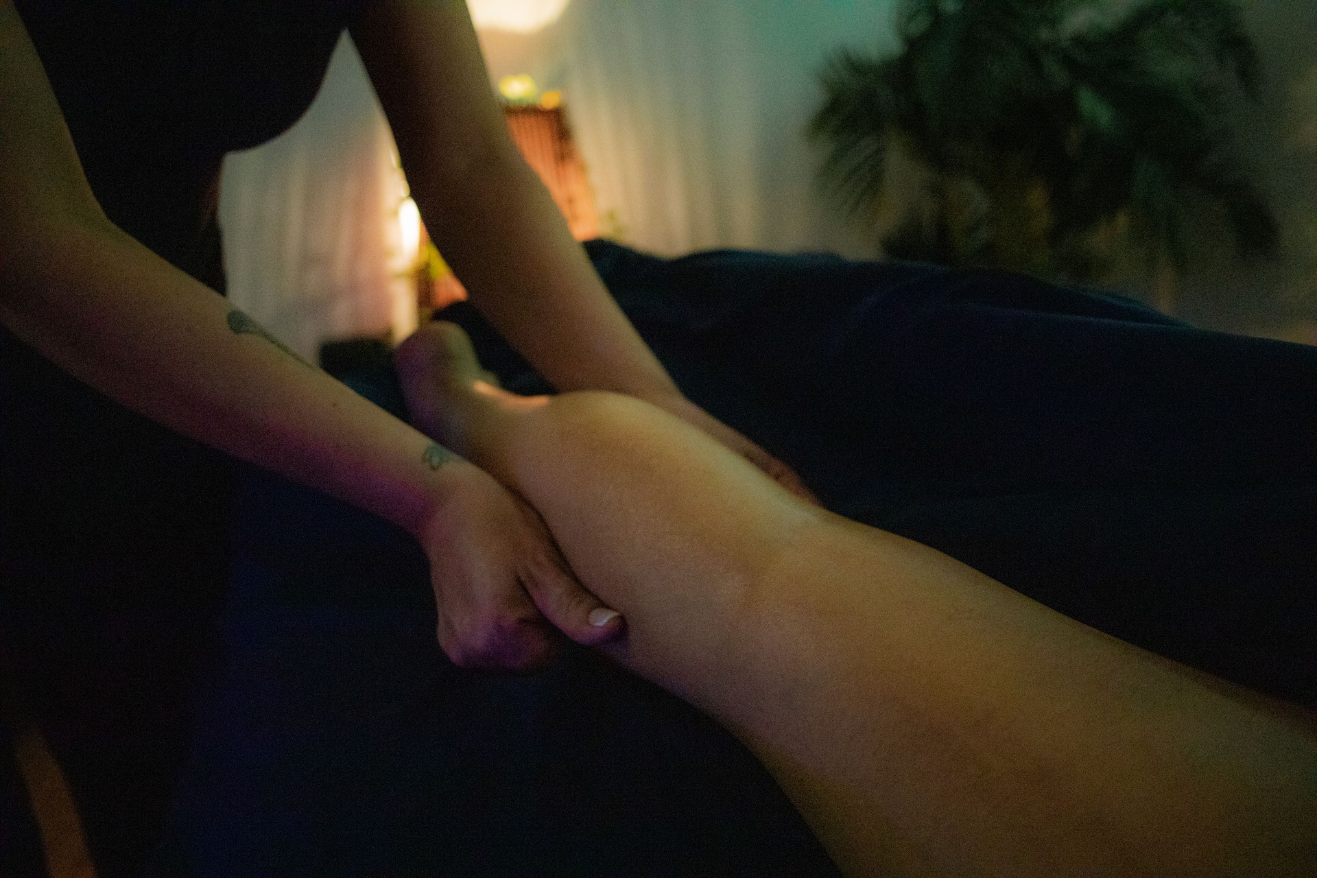 Masseuse massaging client